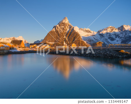 North. Lofoten Islands, Norway. Picturesque view of traditional Norwegian fishermen's houses. North. Lofoten Islands, Norway. Picturesque view of traditional Norwegian fishermen's houses. 133449147