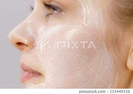 Girl with cream moisture cosmetic on face Girl with cream moisture cosmetic on face 133449338