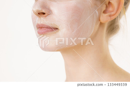 Girl with cream moisture cosmetic on face Girl with cream moisture cosmetic on face 133449339
