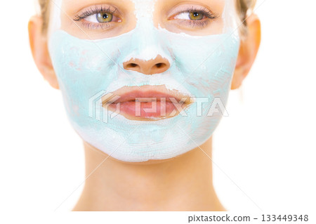 Girl with green mud mask on face Girl with green mud mask on face 133449348