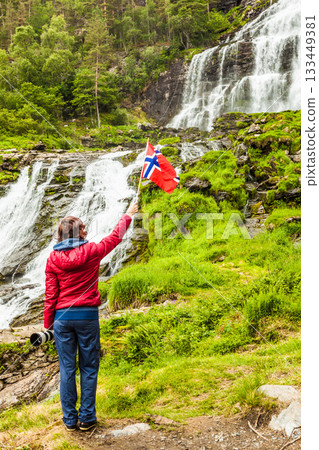 Tourist woman at waterfall Svandalsfossen, Norway Tourist woman at waterfall Svandalsfossen, Norway 133449381