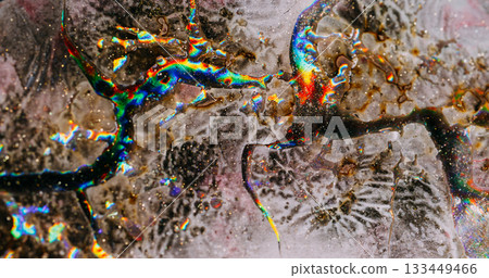 Sparkling liquid. Cracked texture. Defocused gray green blue colorful chemical particles floating on abstract creative background. Sparkling liquid. Cracked texture. Defocused gray green blue colorful chemical particles floating on abstract creative background. 133449466