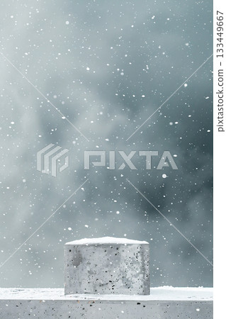 Concrete block product podium covered in snow against a blurred winter background with falling snowflakes Concrete block product podium covered in snow against a blurred winter background with falling snowflakes 133449667