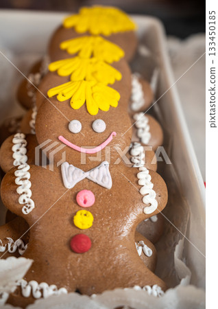 Prague, Czech Republic, August 9, 2023. In a pastry shop window, typical gingerbread cookies shaped like little men. Local food specialties. 133450185