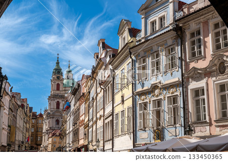 Prague, Czech Republic, August 9, 2023. Shot on a beautiful summer day, from Charles Bridge towards the old Town district. The colorful facades stand out. Crowded with people. Travel destinations. 133450365