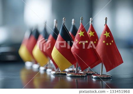 Germany and China Mini Flags on Podium in Diplomatic Conference Setting 133451968
