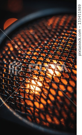 Artistic Macro of Microphone Grille with Warm Orange Stage Lights Artistic Macro of Microphone Grille with Warm Orange Stage Lights 133451989