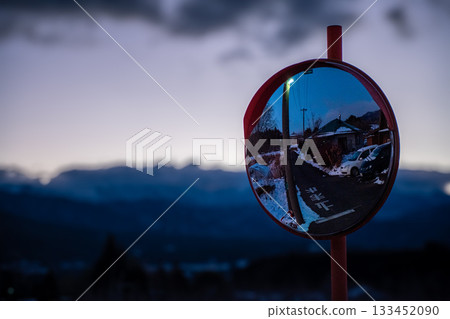 A convex mirror standing in the morning glow A convex mirror standing in the morning glow 133452090