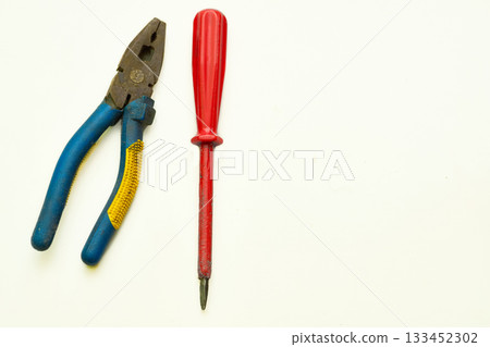 Old rusty pliers,screwdriver from the home shed for repair 133452302