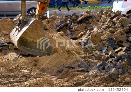 Road work.Excavator bulldozer bucket,road repair 133452304