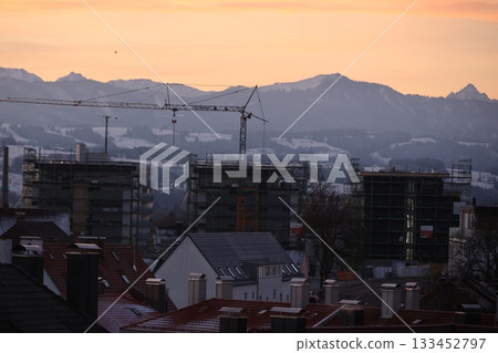 construction site at sunset with mountains in background 133452797