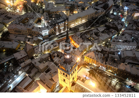 Aerial night View of Tallinn in winter, roofs are covered with snow, Christmas mood Aerial night View of Tallinn in winter, roofs are covered with snow, Christmas mood 133452811