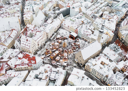 Aerial View of Tallinn with the Town Hall Square in winter, roofs with snow, Christmas mood Aerial View of Tallinn with the Town Hall Square in winter, roofs with snow, Christmas mood 133452823