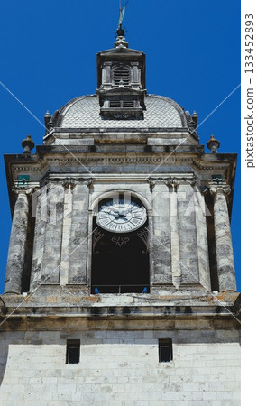 Old building with watches on the top. 133452893