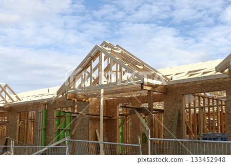 Affordable housing wooden frame construction.New residential building framed with wood 133452948