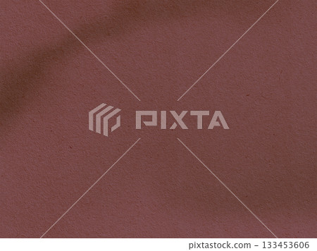 Textured burgundy backdrop. A close-up shot of a burgundy backdrop with a textured surface, offering a rich and inviting visual element. Textured burgundy backdrop. A close-up shot of a burgundy backdrop with a textured surface, offering a rich and inviting visual element. 133453606