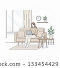 A woman using a computer in the living room 133454429