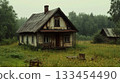 Old wooden house stands in a grassy meadow surrounded by dense forest. Concept of rustic tranquility and solitude. For countryside theme content 133454490