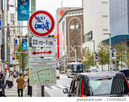 A sign indicating a no-taxis zone in Ginza and a map showing taxi stands 133456024