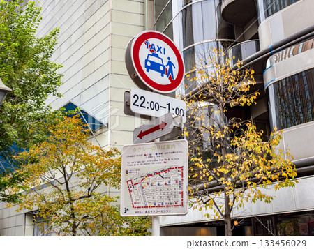 A sign indicating a no-taxis zone in Ginza and a map showing taxi stands 133456029