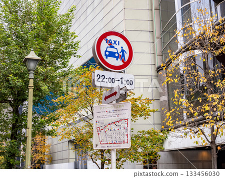 A sign indicating a no-taxis zone in Ginza and a map showing taxi stands 133456030