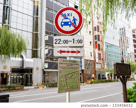 A sign indicating a no-taxis zone in Ginza and a map showing taxi stands 133456032