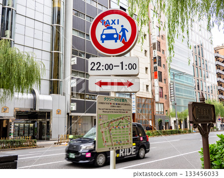 A sign indicating a no-taxis zone in Ginza and a map showing taxi stands 133456033
