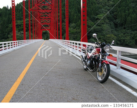 Motorcycle touring with vintage cars 133456171