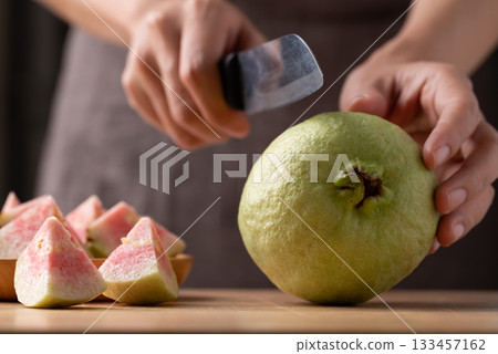 Red guava cutting on wooden board, Tropical fruit high vitamin C 133457162