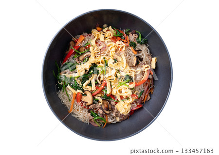 Japchae, Korean stir fried glass noodles with vegetables, pork, soy sauce and sesame oil Japchae, Korean stir fried glass noodles with vegetables, pork, soy sauce and sesame oil 133457163