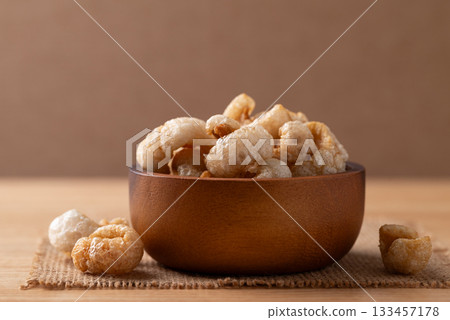 Pork rind in a wooden bowl, Northern Thai food 133457178