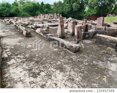 Ancient stone ruins with a pattern, fragments of ancient buildings and structures of the Mauryan empire (Indian ancient history) 133457349