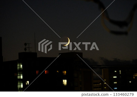 Crescent moon and building 133460279
