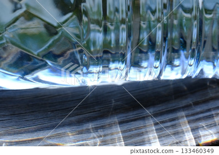 A close-up of a plastic bottle that shines through the light A close-up of a plastic bottle that shines through the light 133460349