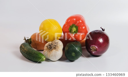 Fresh organic vegetables on a white surface, showing balance between healthy eating and dietary supplements Fresh organic vegetables on a white surface, showing balance between healthy eating and dietary supplements 133460969