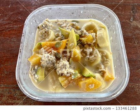 Close up view of delicious food, Overnight Oats, Banana, Avocado Breakfast in a Mug Close up view of delicious food, Overnight Oats, Banana, Avocado Breakfast in a Mug 133461288