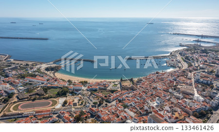 sines portugal. harbor dawn scene, early morning maritime activity with shining reflections at sunrise, aerial perspective capturing sunrise reflections and bustling 133461426