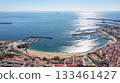 sines portugal. coastal scene panorama, sines harbor and beach view, bright sunlight illuminating seaside townscape, panoramic shot of coastal harbor with sandy beaches 133461427