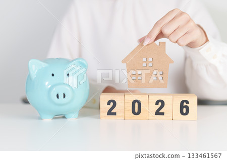 Happy New Year 2026 with house model and Coins stack. real estate, Home loan, tax, investment, mortgage, financial, savings and New Year Resolution concepts Happy New Year 2026 with house model and Coins stack. real estate, Home loan, tax, investment, mortgage, financial, savings and New Year Resolution concepts 133461567