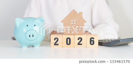 Happy New Year 2026 with house model and Coins stack. real estate, Home loan, tax, investment, mortgage, financial, savings and New Year Resolution concepts Happy New Year 2026 with house model and Coins stack. real estate, Home loan, tax, investment, mortgage, financial, savings and New Year Resolution concepts 133461570