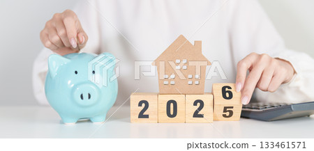 Happy New Year 2026 with house model and Coins stack. real estate, Home loan, tax, investment, mortgage, financial, savings and New Year Resolution concepts Happy New Year 2026 with house model and Coins stack. real estate, Home loan, tax, investment, mortgage, financial, savings and New Year Resolution concepts 133461571