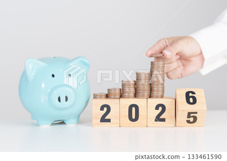 2025 end year to Happy New Year 2026 with piggy bank. Resolution, Goals, Plan, Action, Money Saving, Retirement fund, Pension, Investment and Financial concepts 133461590