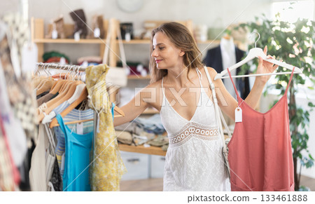 Young woman shopping in a clothing store 133461888