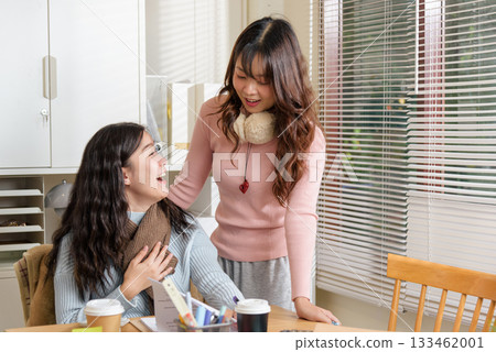 Young business people busy working, meeting in office, financial team consults, collaborating with enthusiastic smiles for work success, fostering productive business environment. 133462001