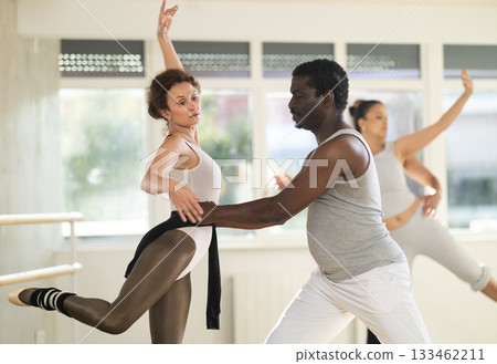 Man and woman rehearsing a couple ballet dance together in studio Man and woman rehearsing a couple ballet dance together in studio 133462211