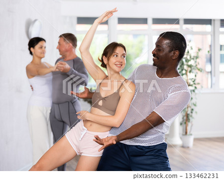 Adult man and young woman dancing pair dance 133462231