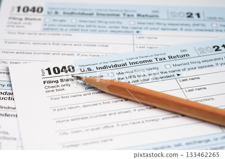 Tax Return form 1040 with pencil, U.S. Individual Income. 133462265