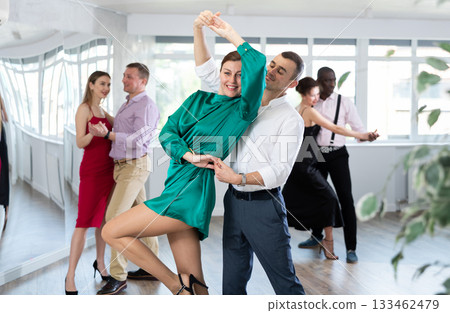 Man and woman dancing waltz in couple during lesson at studio Man and woman dancing waltz in couple during lesson at studio 133462479