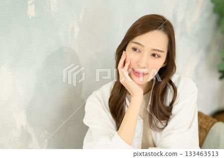 Woman putting hand on face Woman putting hand on face 133463513