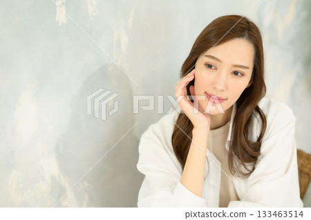 Woman putting hand on face Woman putting hand on face 133463514